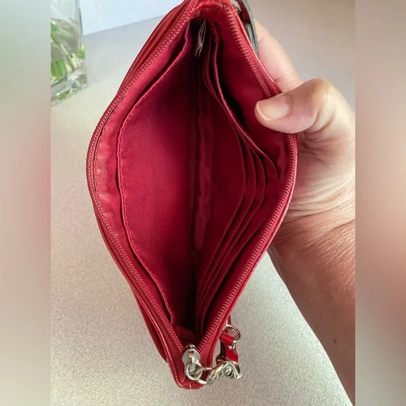 Coach Glossy Embossed Signature Wristlet
Cranberry Patent Leather Red - Picture 7 of 13